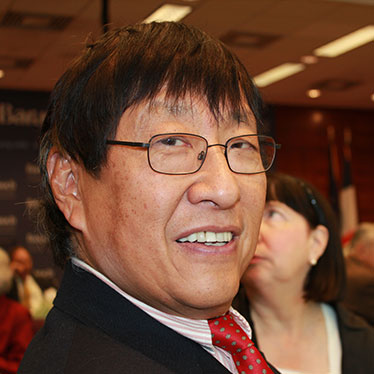 Man in suit and tie smiling at camera. Read about Beneficiary Designations Man in suit and tie smiling at camera. Read about Beneficiary Designations